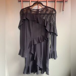 Vanessa Scott lace and ruffle black dress.